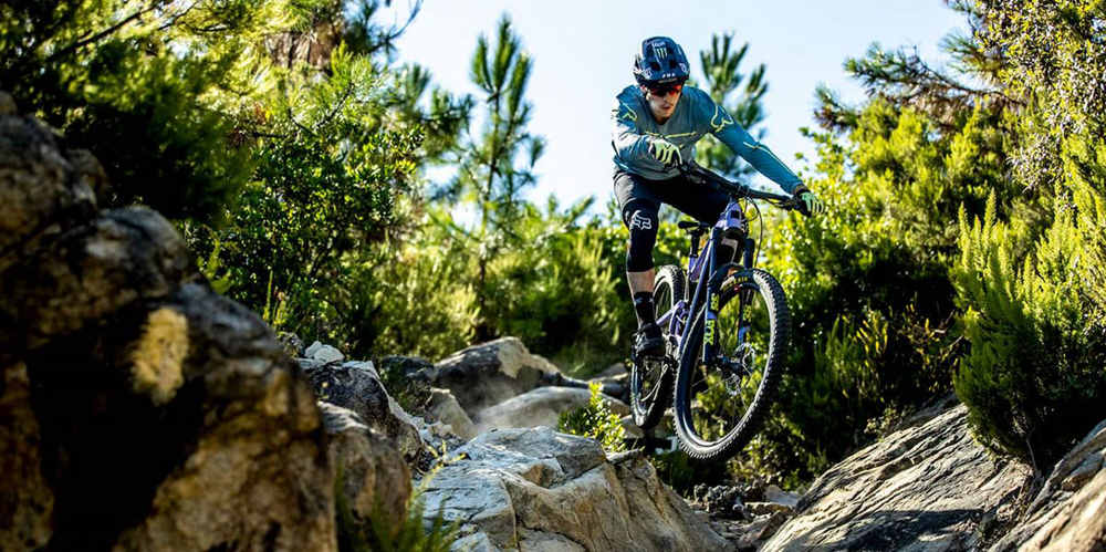 a professional cyclist explores in the wild with his full suspension electric mountain bike